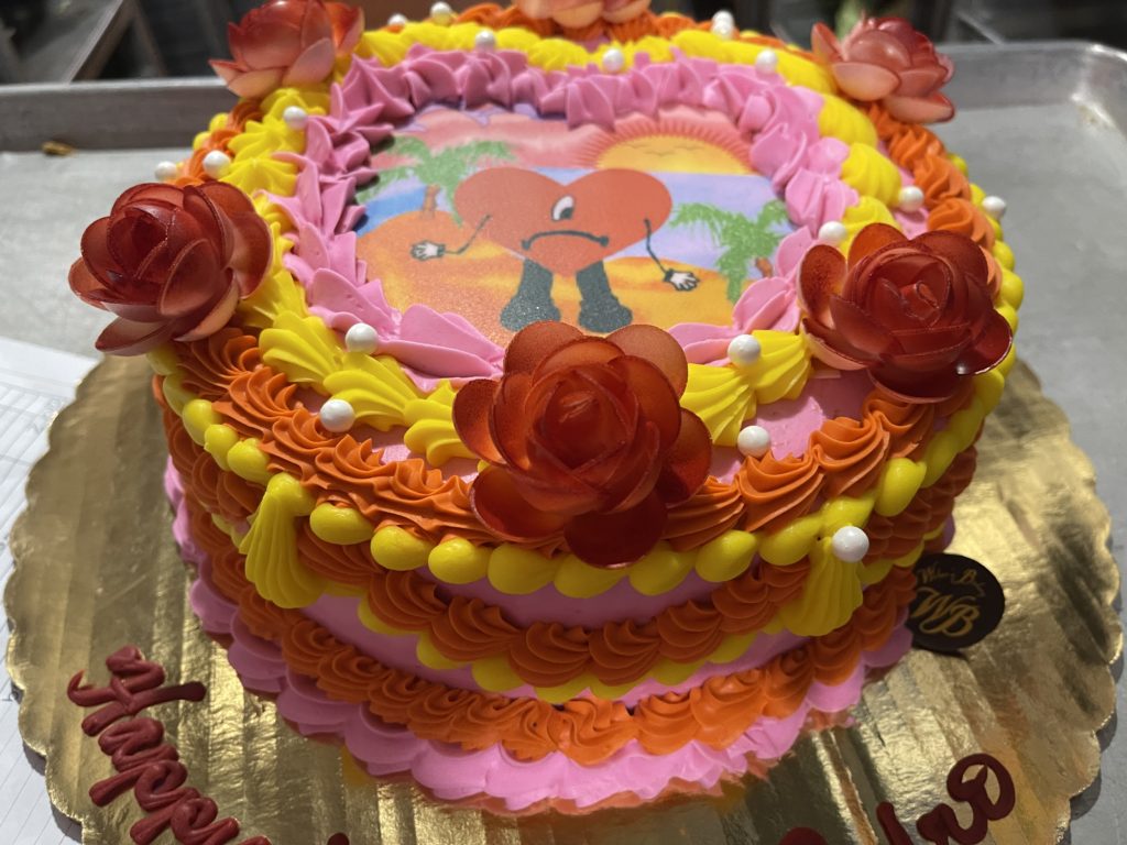 Multicolored cake with red flowers