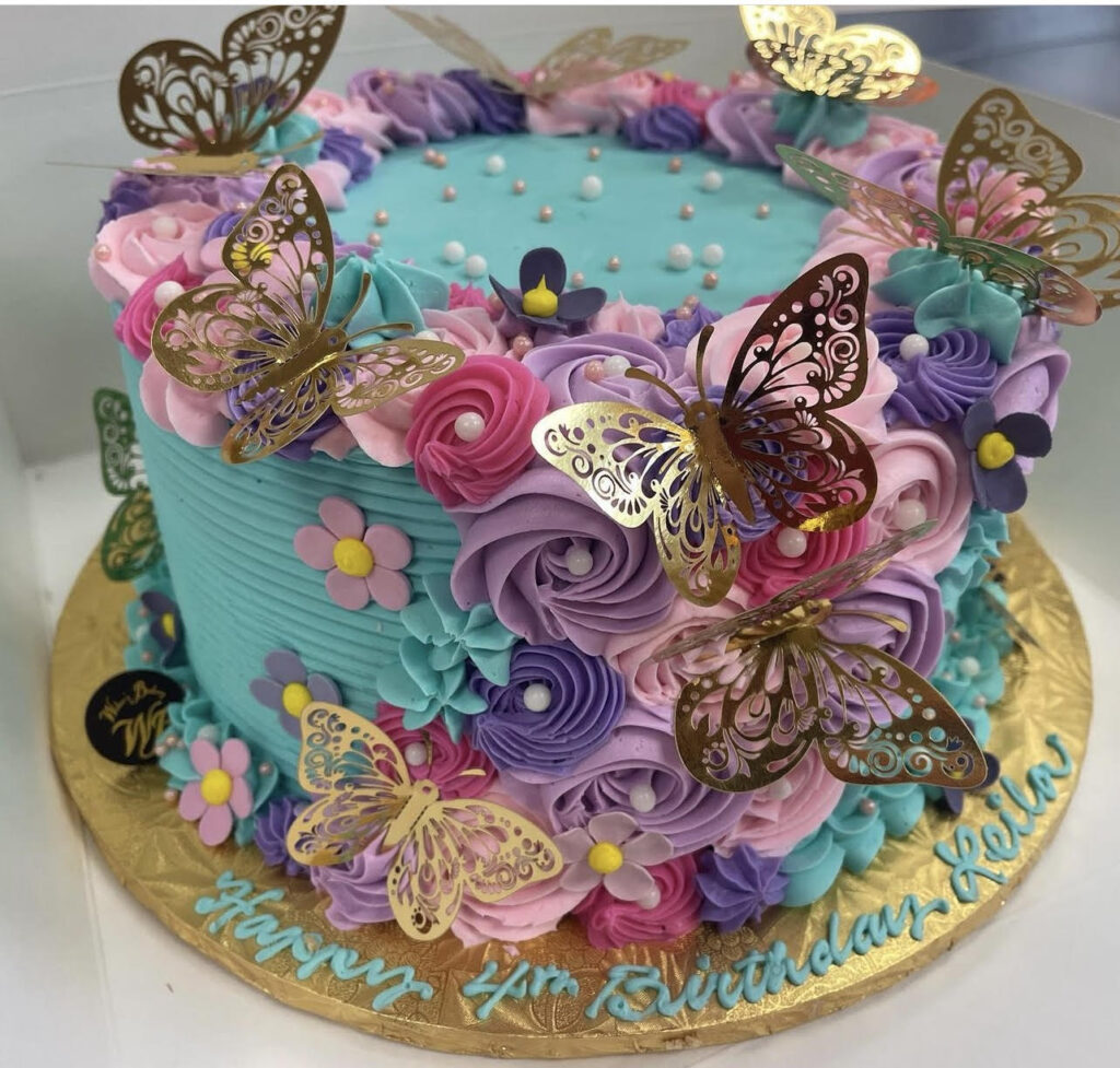 Multicolored cake with gold butterflies