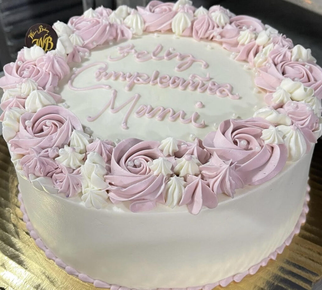 Pink and white birthday cake